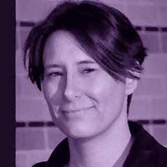 Photo of face with slight smile, recolored with a high-contrast indigo filter.